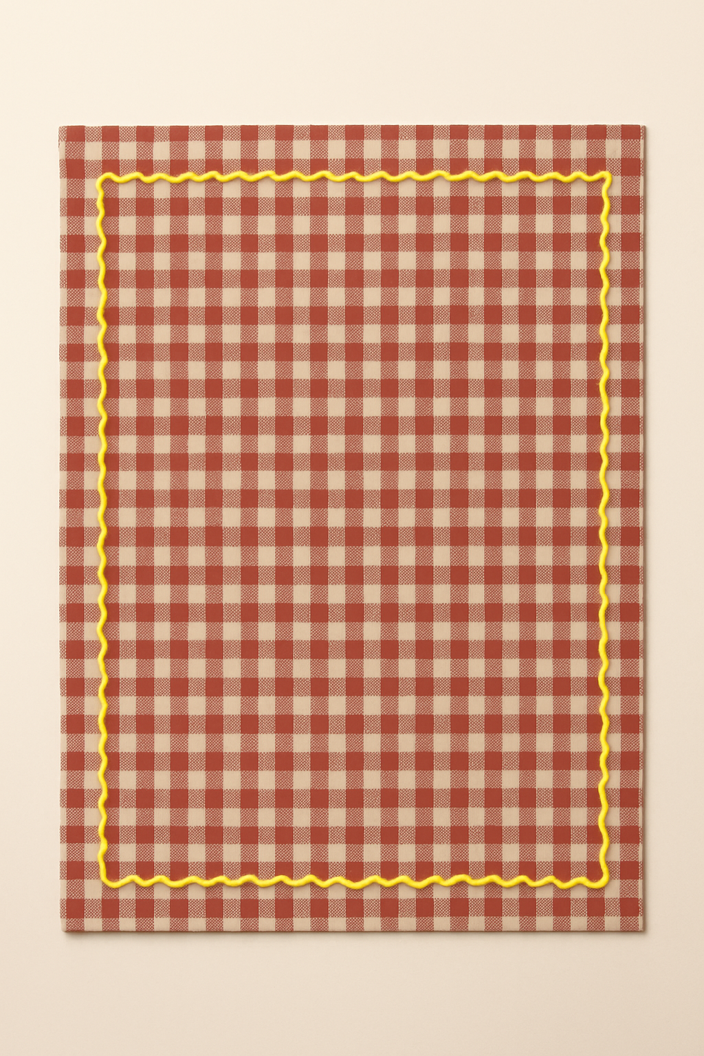Red and white checkered towel with yellow border on a beige background