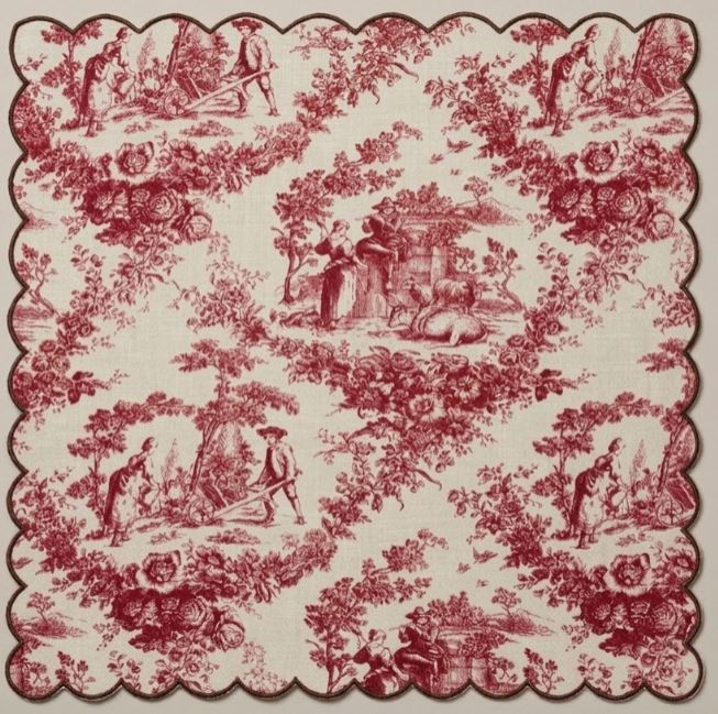 Red floral and landscape pattern on a beige background napkin