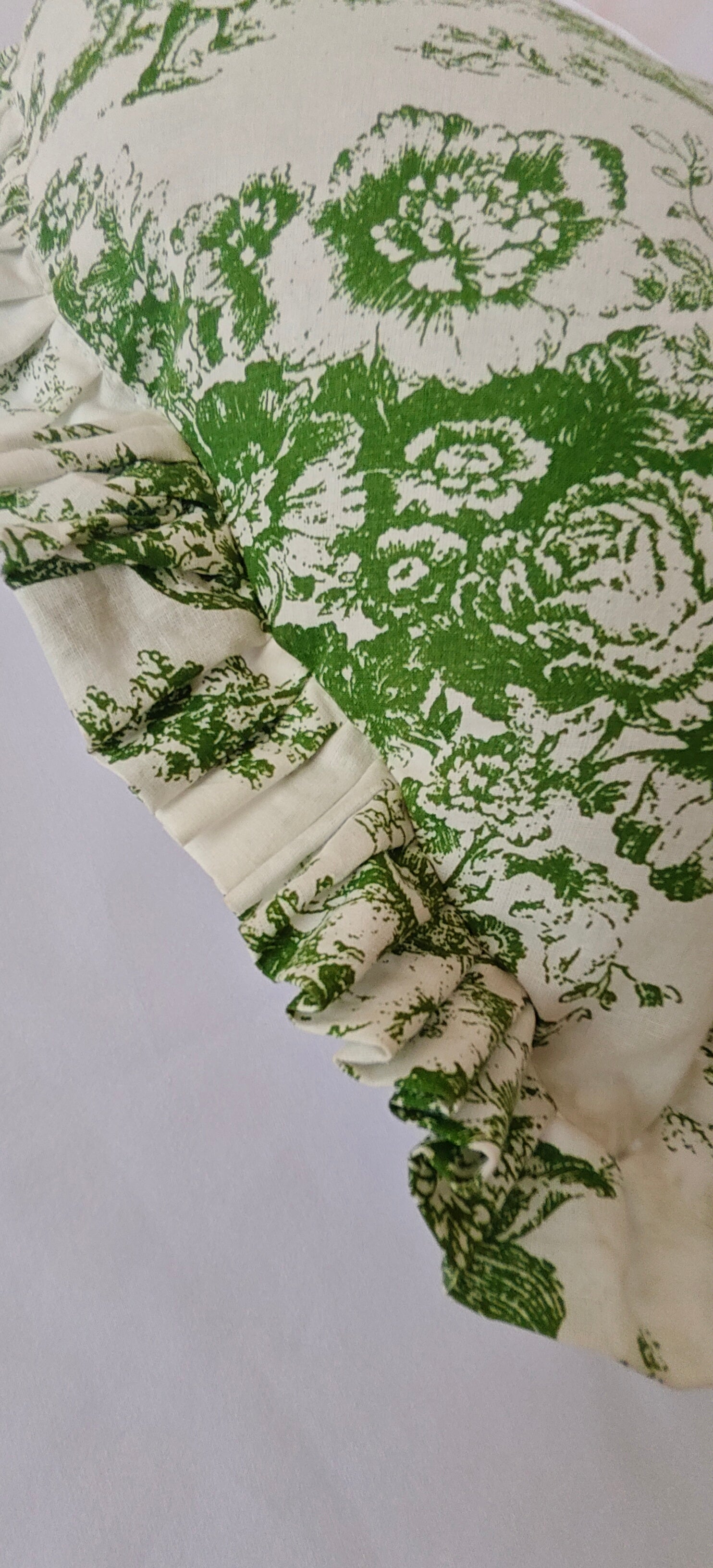 Close-up of green Toile pattern on heart cushion - Viraasa