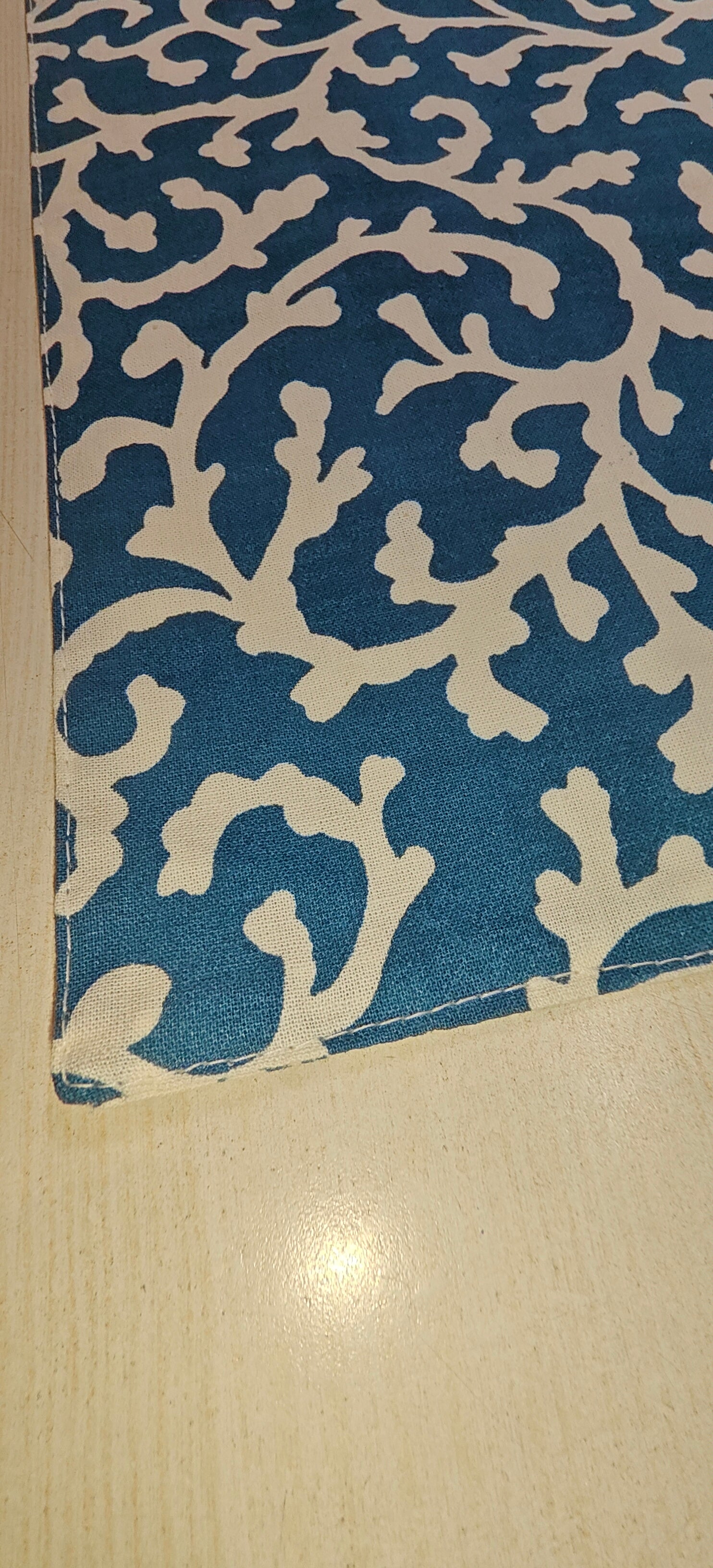 Stack of blue floral placemats - Viraasa luxury home