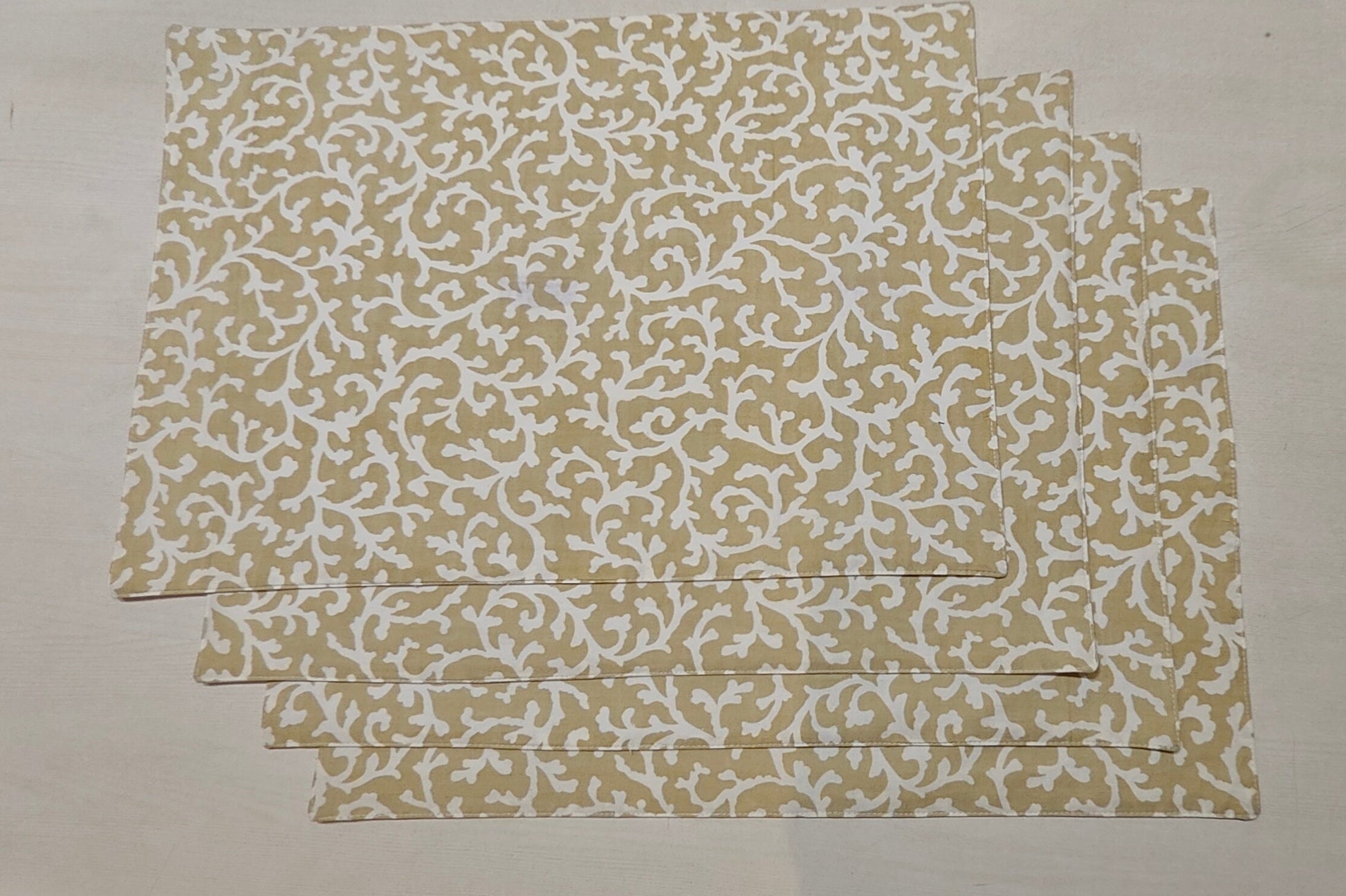 Golden floral placemat set full view - Viraasa luxury dining linens