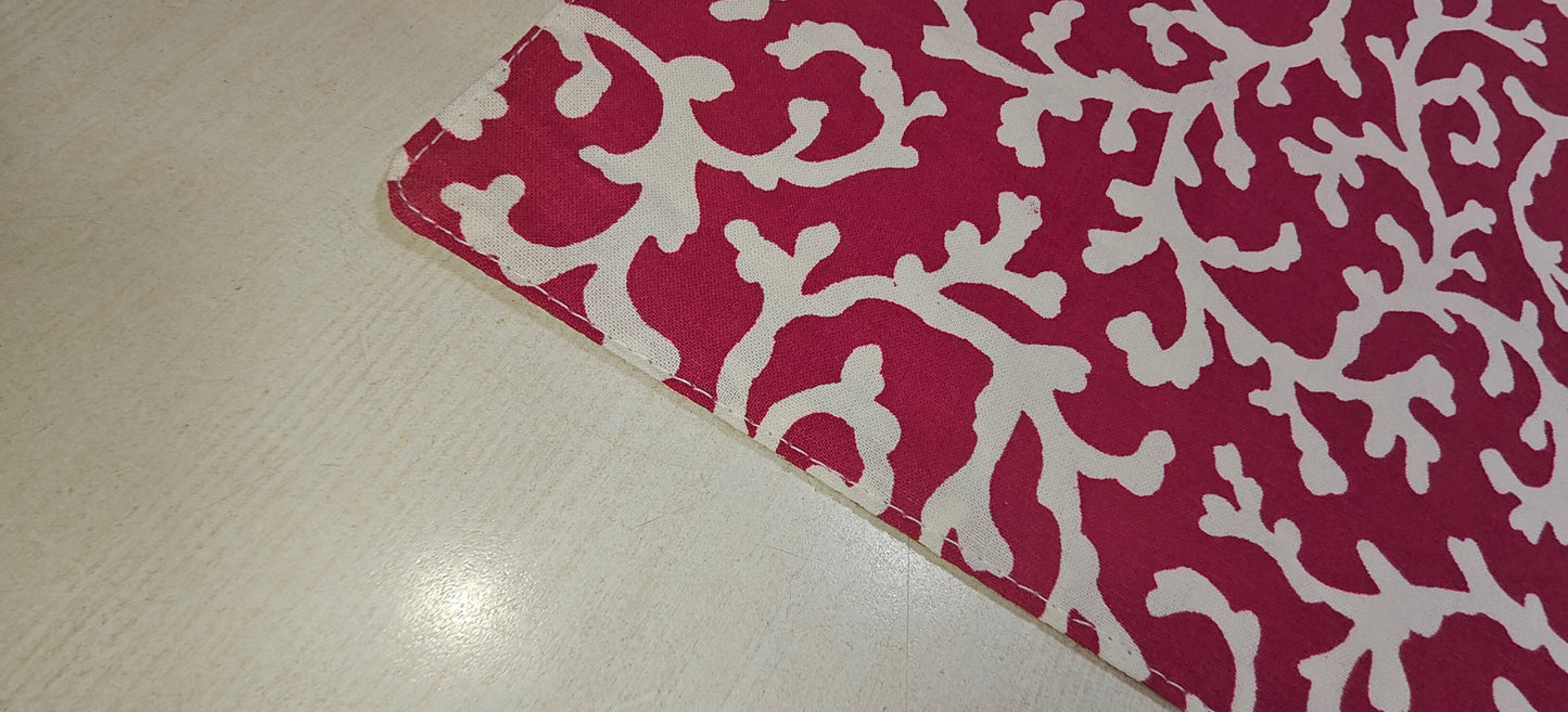 Close-up of red floral cotton fabric - Viraasa luxury dining