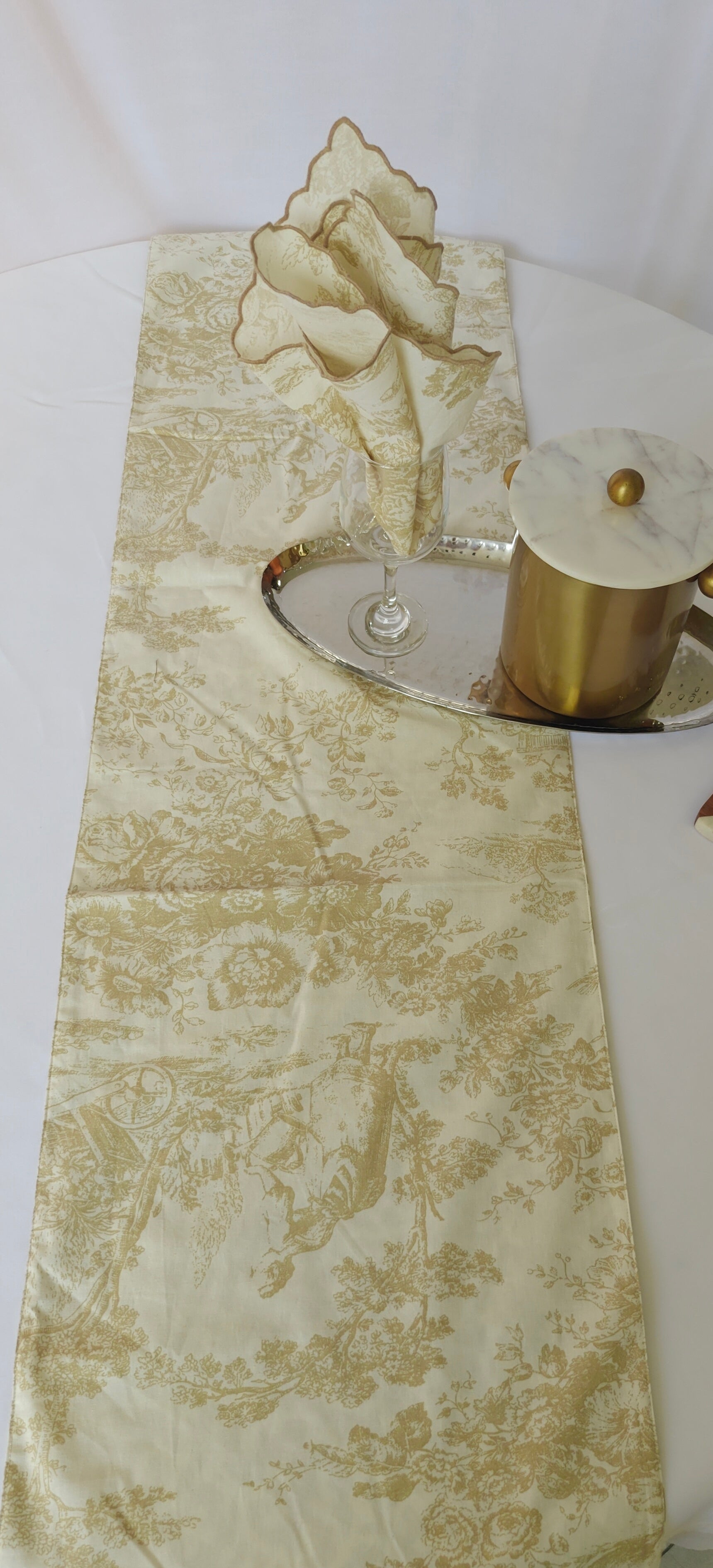 Decorative table runner with floral pattern on a white surface