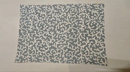 Rectangular mat with a gray pattern on a beige background