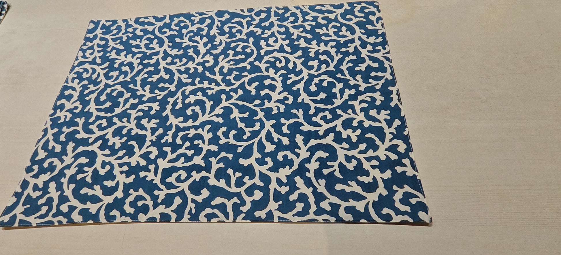 Blue floral placemats styled on dining table - Viraasa