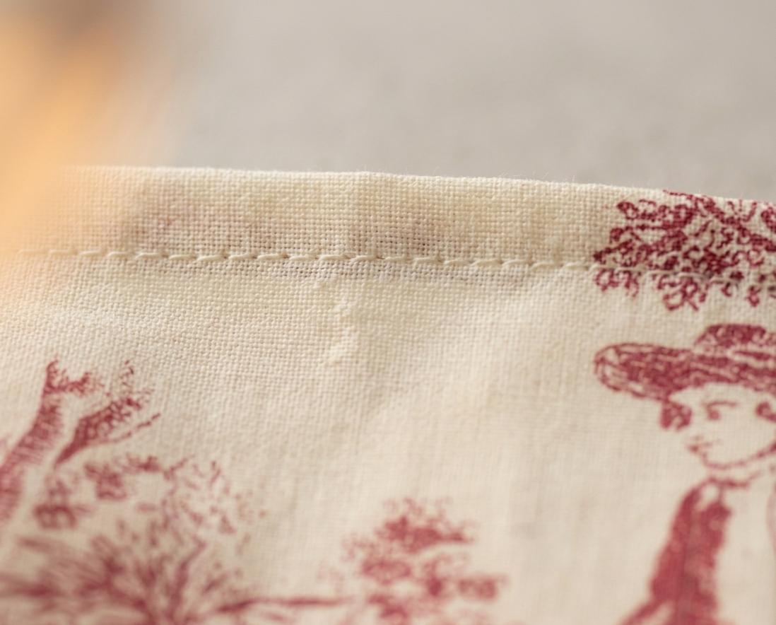 Red Toile cocktail napkins styled on dining table - Viraasa