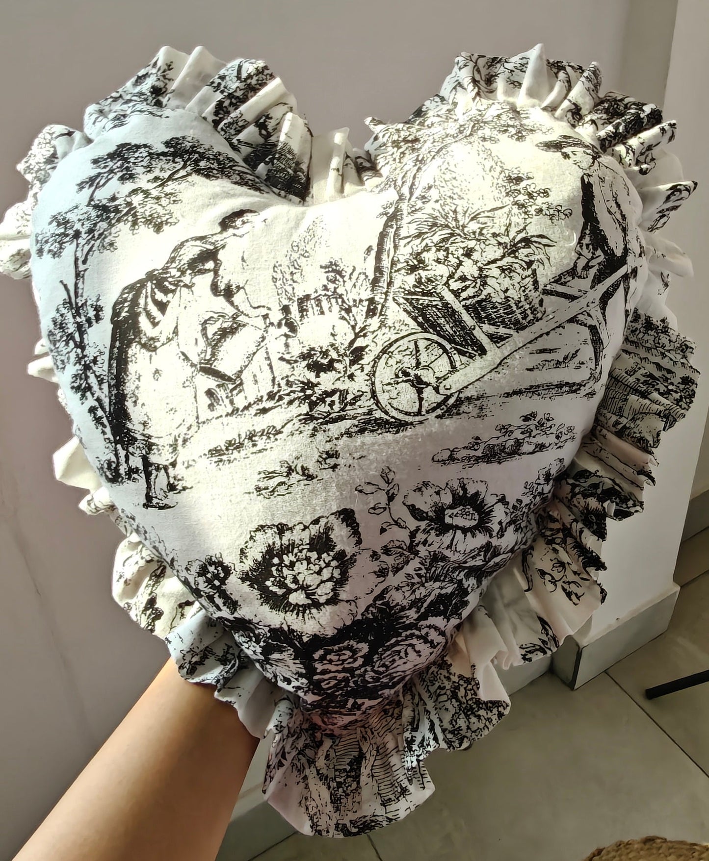 Close-up of black Toile pattern on heart cushion - Viraasa