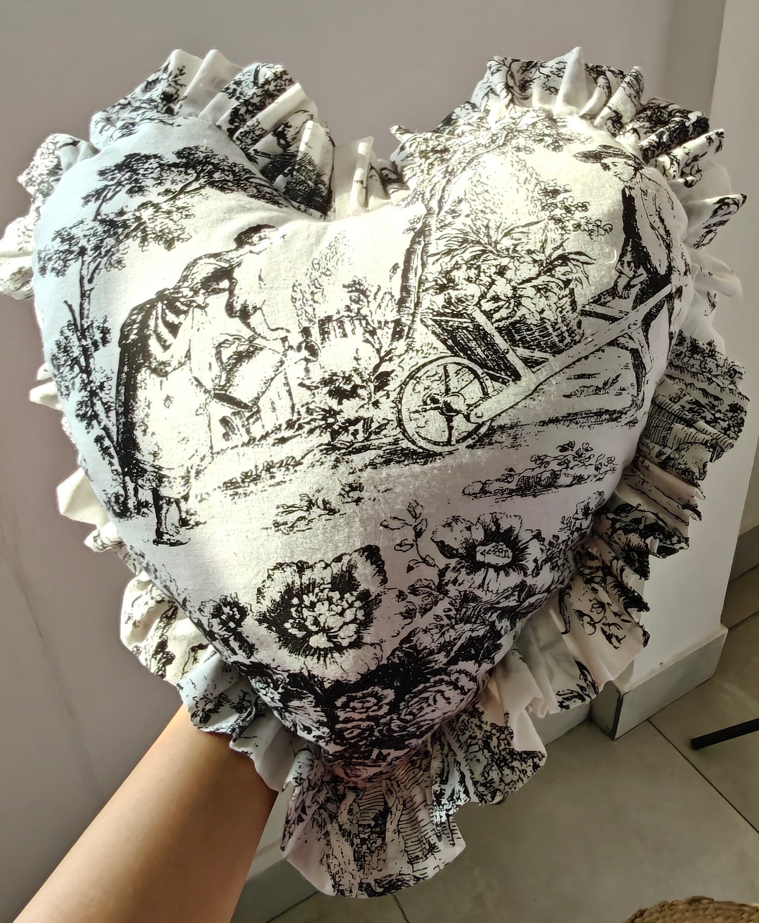 Close-up of black Toile pattern on heart cushion - Viraasa