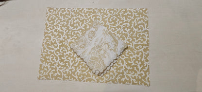 Stack of golden floral placemats - Viraasa luxury home