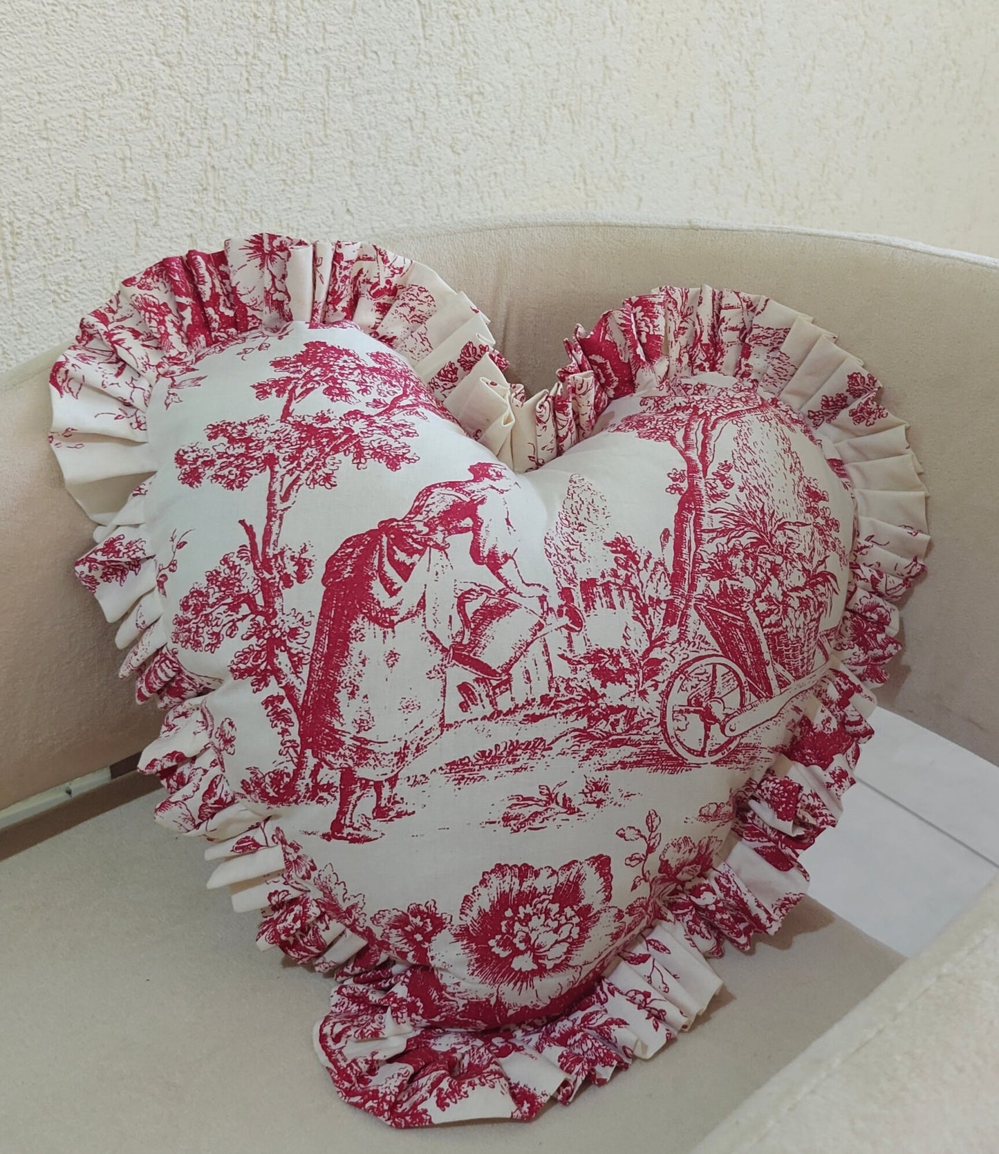 Red Toile heart cushion styled on sofa - Viraasa luxury home