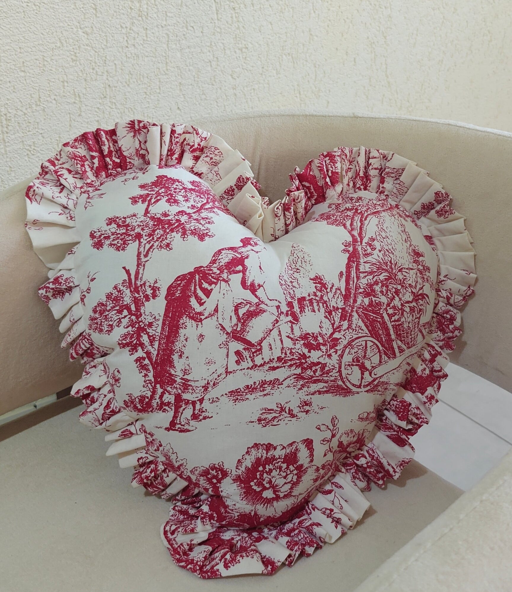 Red Toile heart cushion styled on sofa - Viraasa luxury home