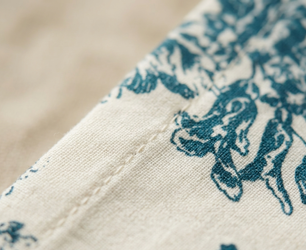 Close-up of Blue Toile cotton napkin fabric - Viraasa luxury