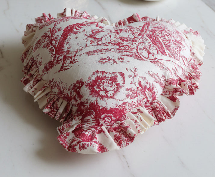 Close-up of red Toile pattern on heart cushion - Viraasa