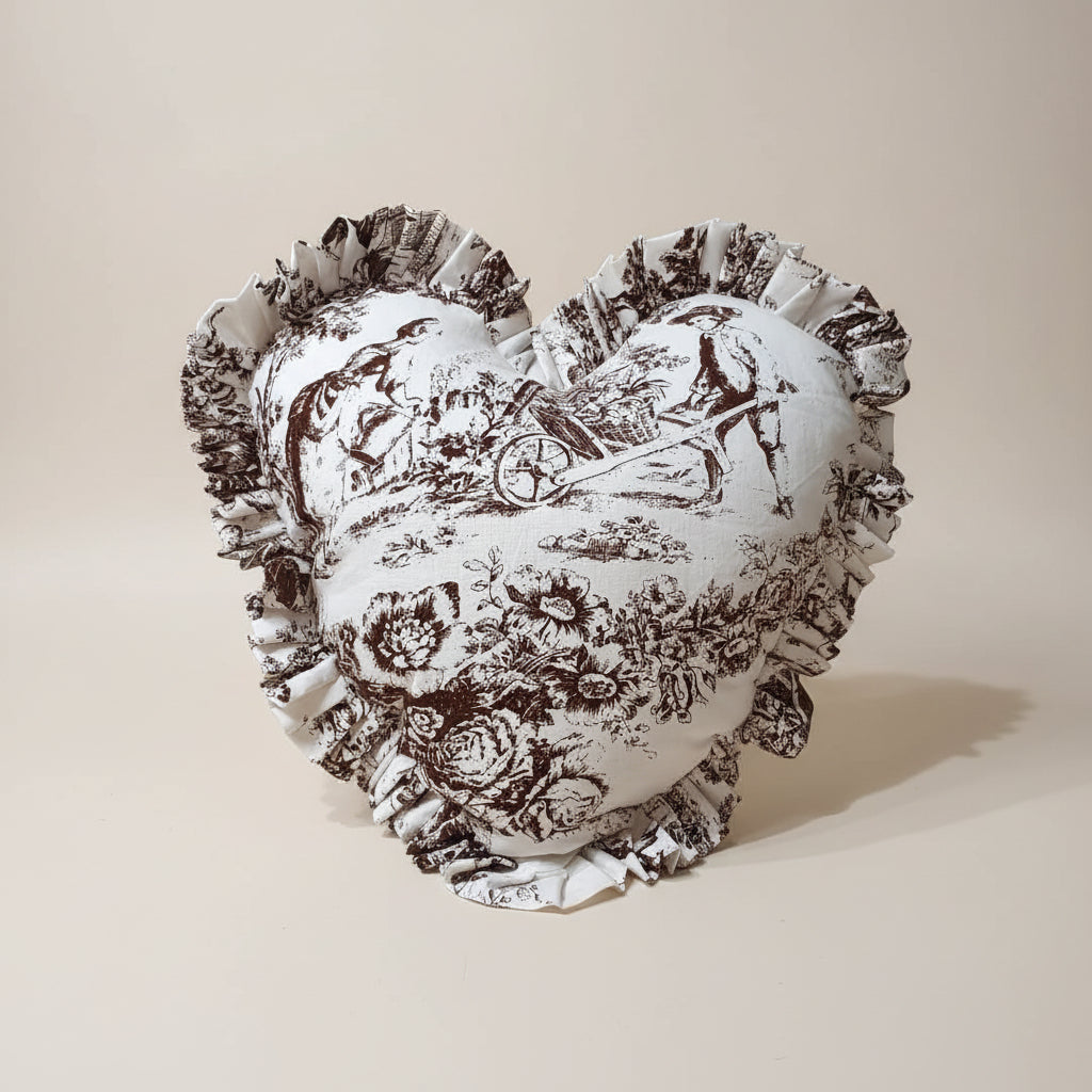 Brown Toile heart cushion styled on sofa - Viraasa luxury home